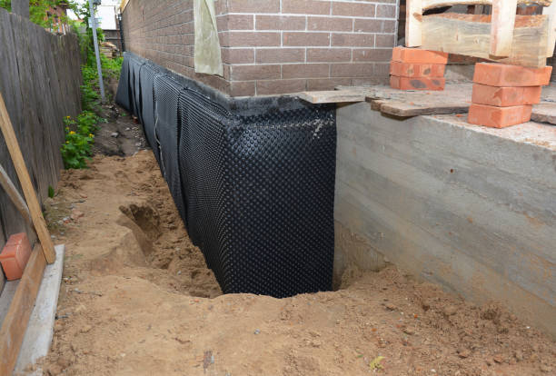SJ Waterproofing Pros technician performing targeted Waterproofing assessment in Lebanon, VA